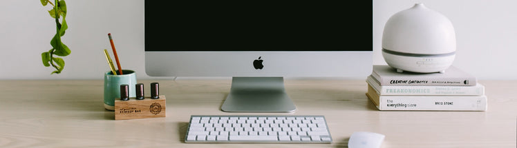 Apple computer placed with deluxe aroma om diffuser and diffuser blends