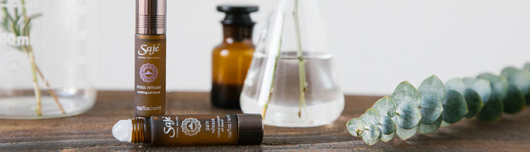 Pain release roll-on and stress release roll-on next to plants