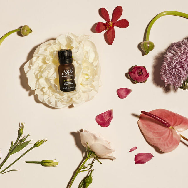 Goddess 0.34 fl oz resting on a flower with floral bits surrounding