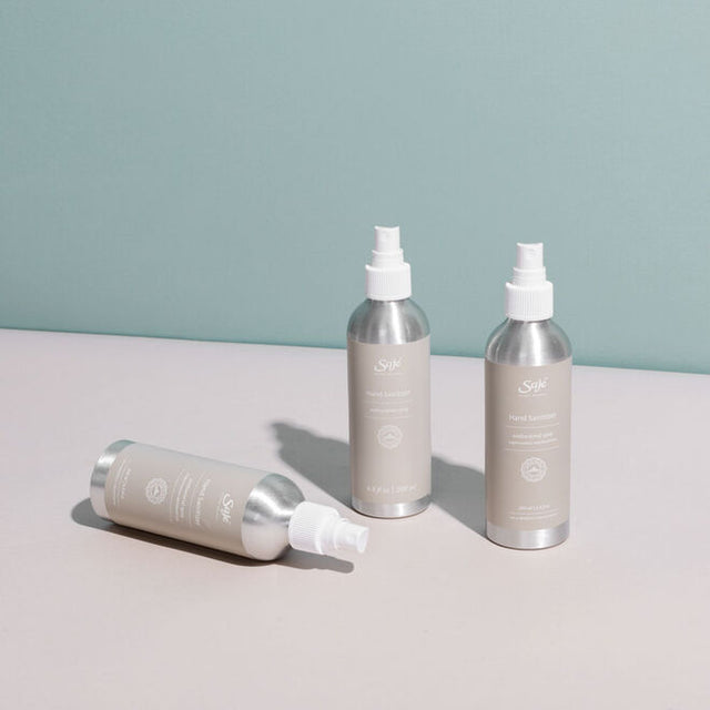 Three bottles of 3.4 fl oz Hand Sanitizer antibacterial spray 