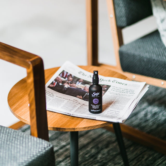 Stress release mister placed on side table in living room