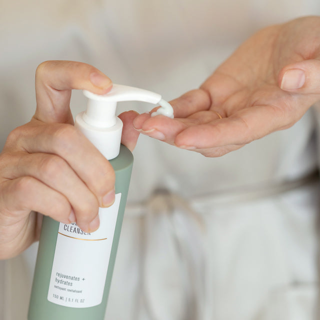 person pumping True Dew Cream Cleanser into hand