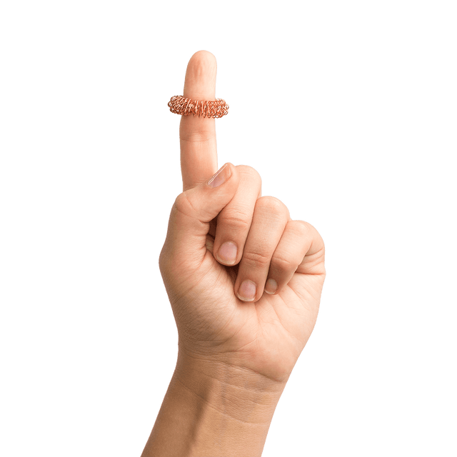 relax-o-ring copper massage ring on person's finger